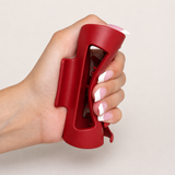 Berry flexible rectangular claw clip gently squeezed in a manicured hand
